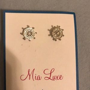 Sterling silver wheel earrings with gems.
